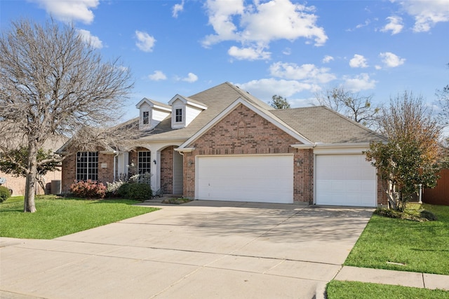 view of front of property featuring a garage and a front yard