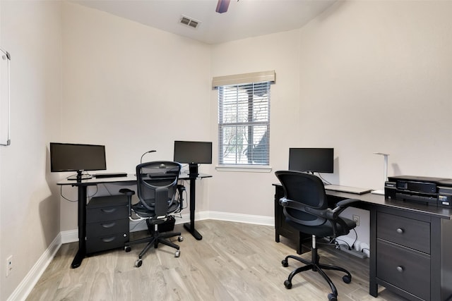 home office with ceiling fan and light hardwood / wood-style flooring