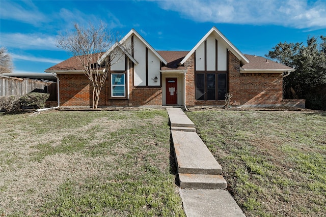 view of front of property with a front lawn and a carport