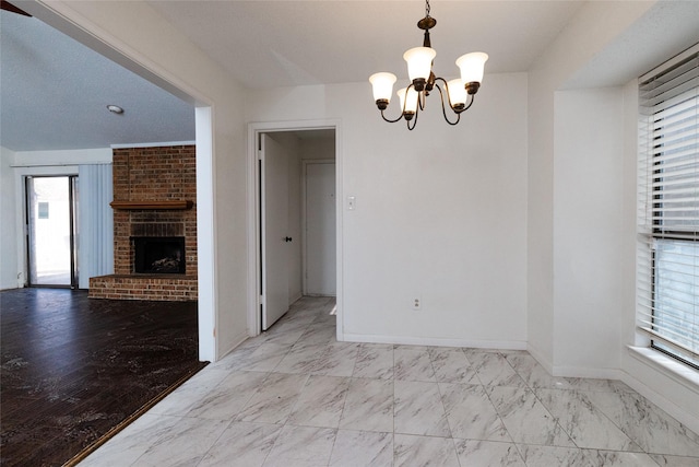 unfurnished dining area with a fireplace and a chandelier