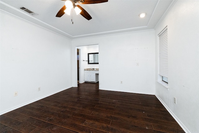 interior space featuring a textured ceiling, ceiling fan, ornamental molding, and dark hardwood / wood-style flooring