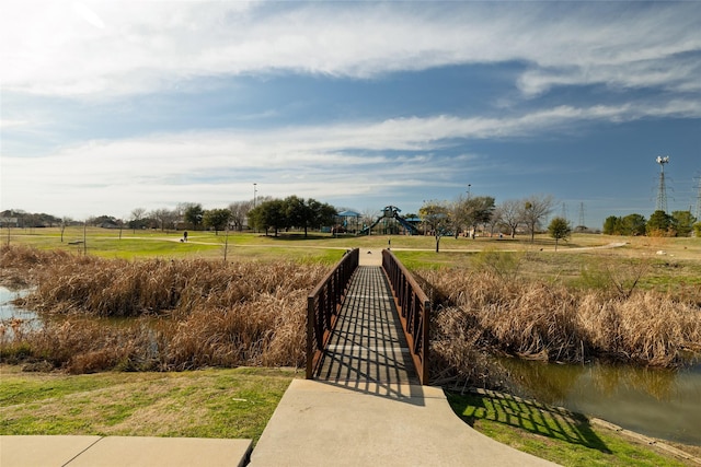 surrounding community featuring a water view