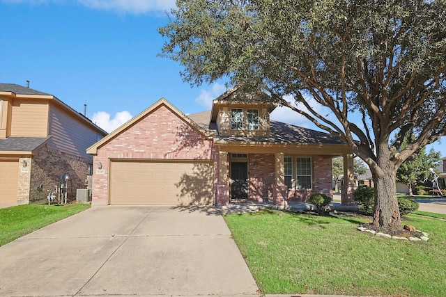 view of front facade with cooling unit, a front lawn, and a garage