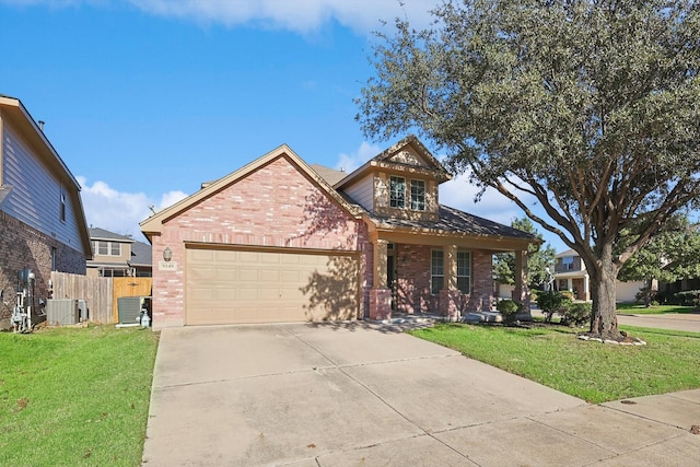 view of front of house featuring a front yard, a garage, and central air condition unit