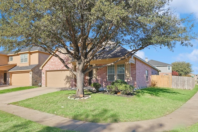 view of front of house featuring a garage and a front lawn