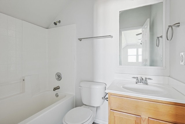 full bathroom featuring toilet, vaulted ceiling, bathtub / shower combination, and vanity