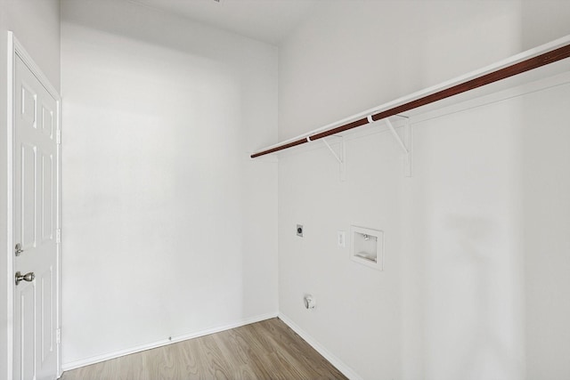 laundry room featuring hookup for a washing machine, hookup for an electric dryer, and light wood-type flooring