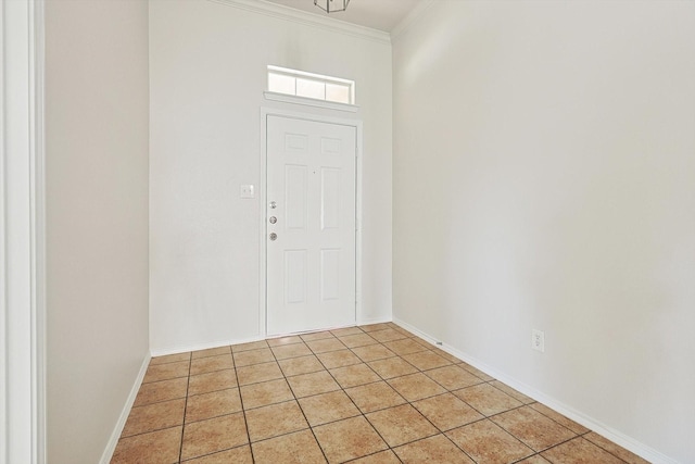 entryway with ornamental molding and light tile patterned flooring