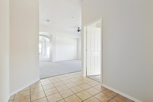 hallway with light tile patterned floors