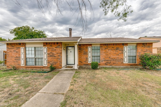 ranch-style house with a front yard