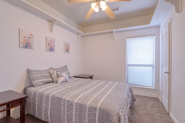 carpeted bedroom with ceiling fan