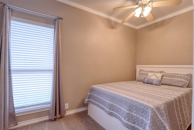 bedroom with multiple windows, ceiling fan, carpet, and crown molding