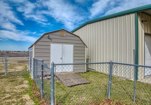 view of outbuilding with a lawn