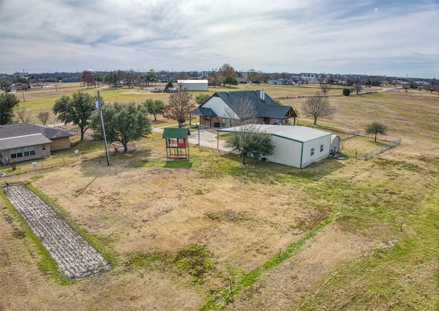 birds eye view of property with a rural view