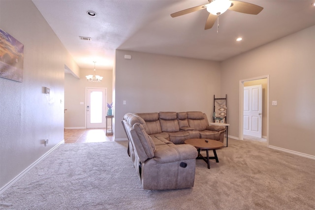 living room with light colored carpet and ceiling fan with notable chandelier