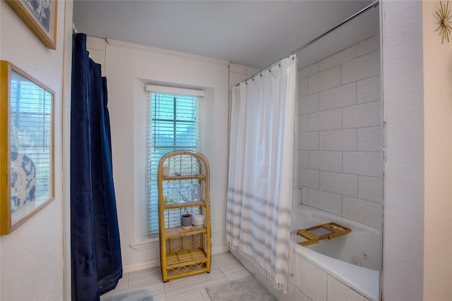 bathroom with tile patterned flooring, shower / bath combo with shower curtain, and ornamental molding