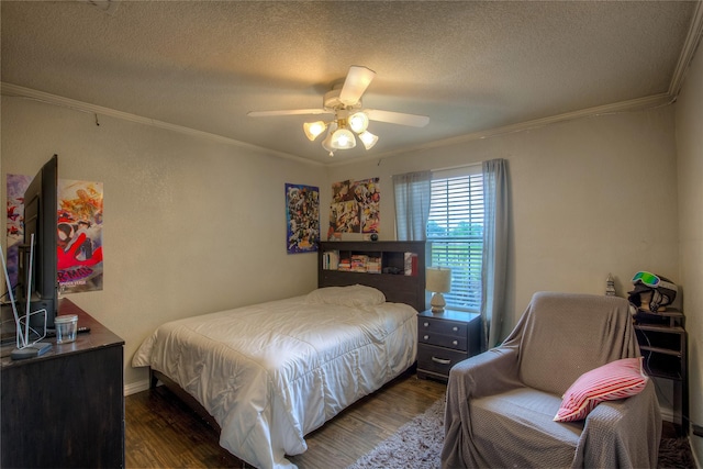 bedroom with ceiling fan, dark hardwood / wood-style flooring, ornamental molding, and a textured ceiling