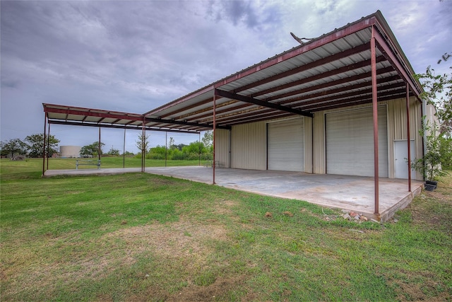 exterior space featuring a lawn and a garage