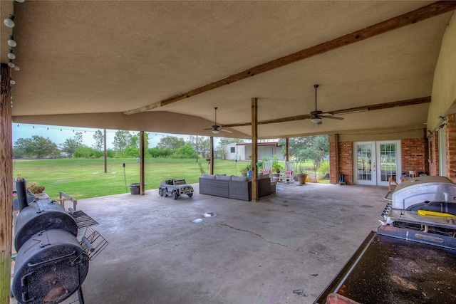 view of patio / terrace with ceiling fan, french doors, and an outdoor living space