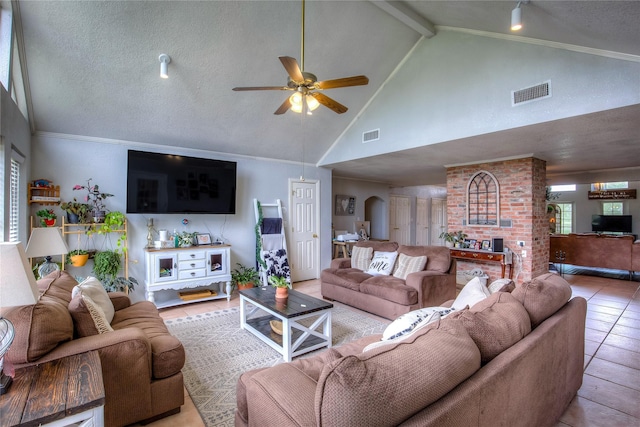 tiled living room featuring high vaulted ceiling, ceiling fan, a textured ceiling, and beamed ceiling