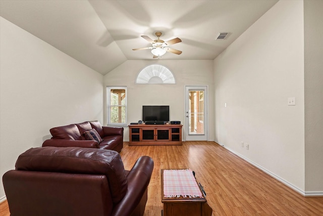 living room with vaulted ceiling, ceiling fan, and light hardwood / wood-style flooring