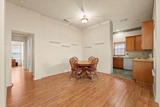 dining room featuring light hardwood / wood-style floors and sink