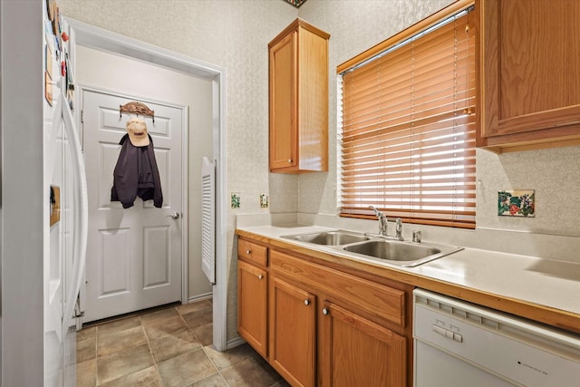 kitchen with sink and white appliances