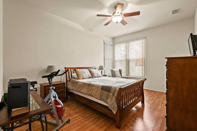 bedroom with hardwood / wood-style flooring and ceiling fan