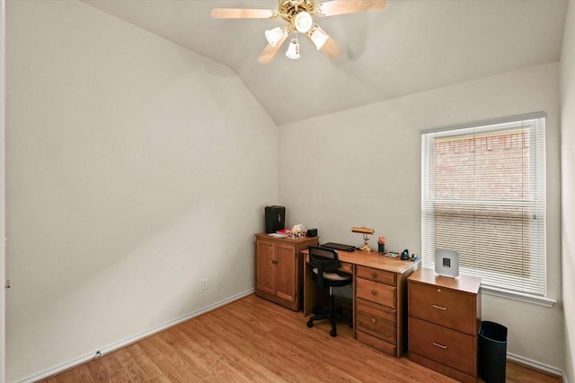 office space featuring ceiling fan, light wood-type flooring, and lofted ceiling