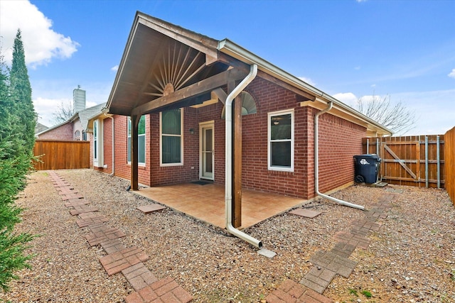 view of side of property with a patio