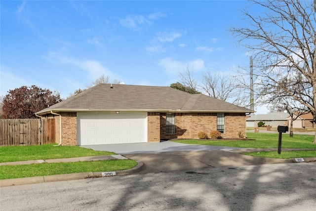 view of front of house featuring a front yard and a garage