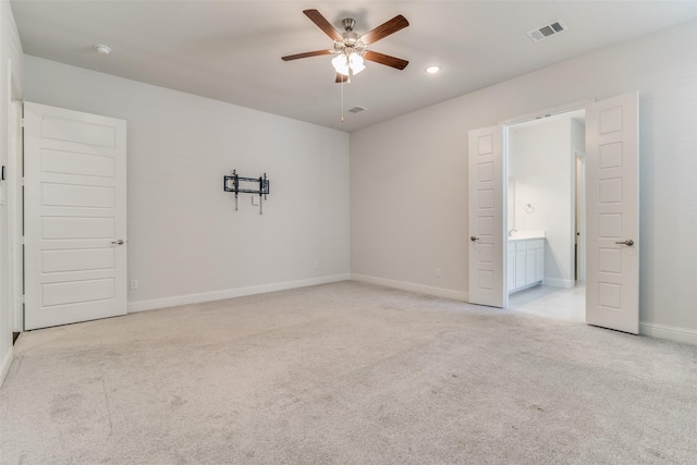 unfurnished room with light carpet and ceiling fan