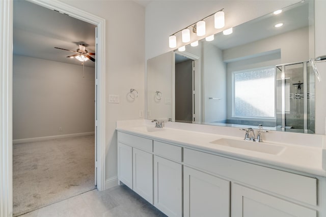 bathroom featuring vanity, walk in shower, and ceiling fan