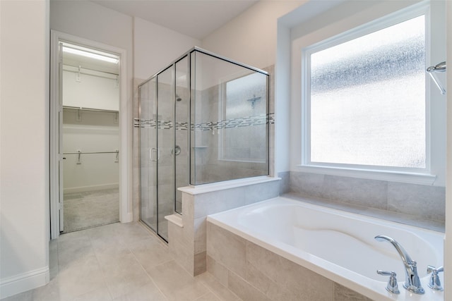 bathroom with tile patterned floors and independent shower and bath