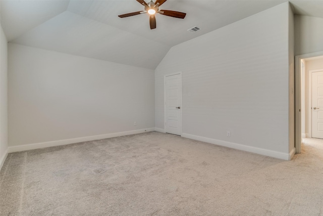 bonus room featuring lofted ceiling, light colored carpet, and ceiling fan