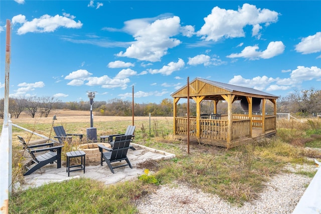 view of yard with a gazebo and a fire pit