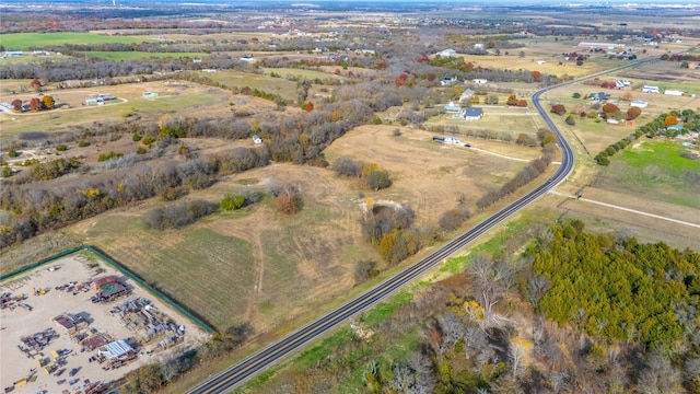 birds eye view of property featuring a rural view