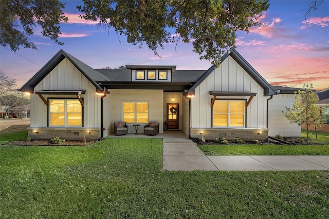 view of front of house with a lawn