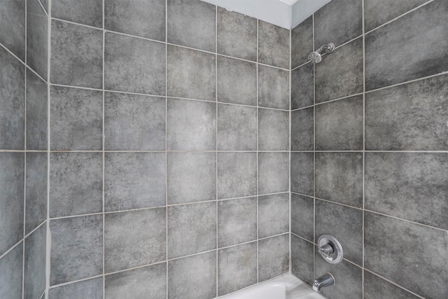 details with tiled shower / bath combo