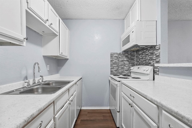 kitchen featuring sink, white cabinets, white appliances, decorative backsplash, and dark hardwood / wood-style flooring