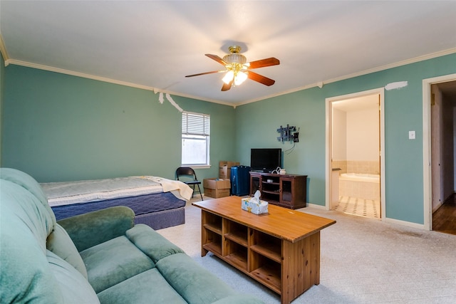 bedroom with ceiling fan, connected bathroom, crown molding, and carpet flooring