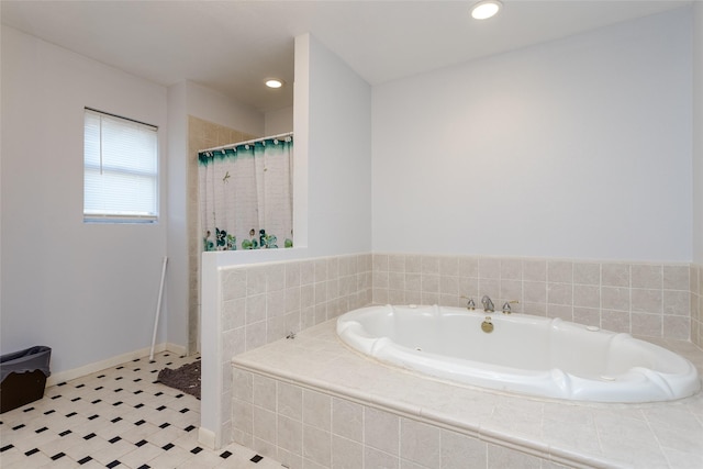 bathroom featuring tile patterned flooring and separate shower and tub