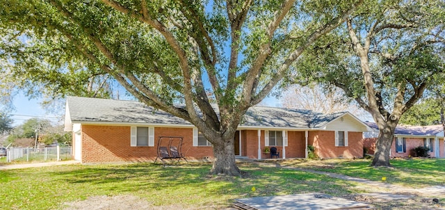 ranch-style house featuring a front lawn