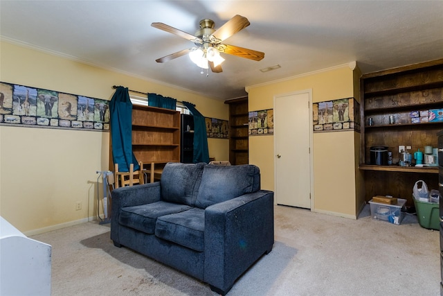 carpeted living room featuring ceiling fan and crown molding