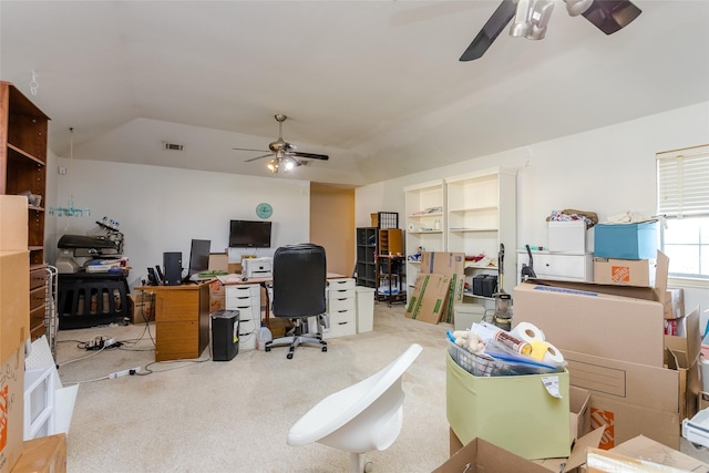 carpeted home office with lofted ceiling and ceiling fan