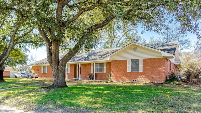 ranch-style home featuring a front yard