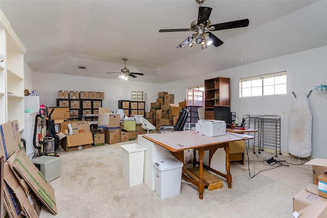 carpeted home office featuring ceiling fan