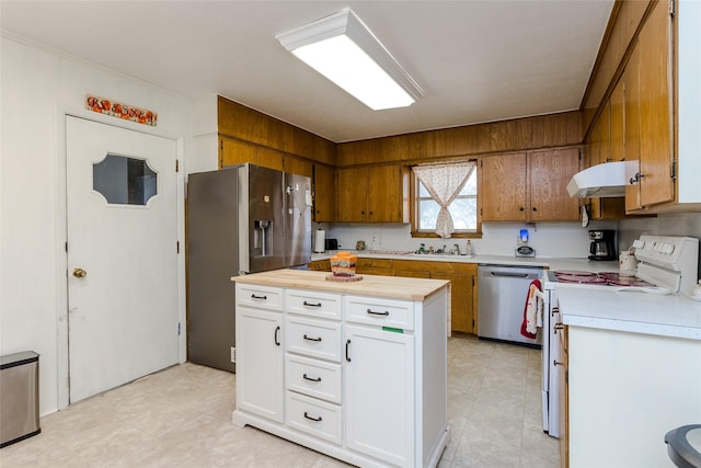 kitchen with sink, white cabinets, and appliances with stainless steel finishes