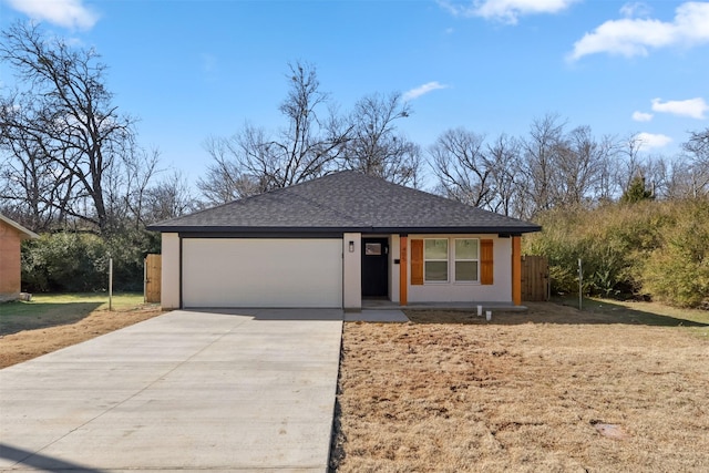 view of front facade with a front yard and a garage