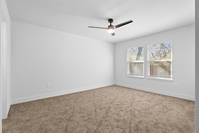 unfurnished room featuring ceiling fan and carpet